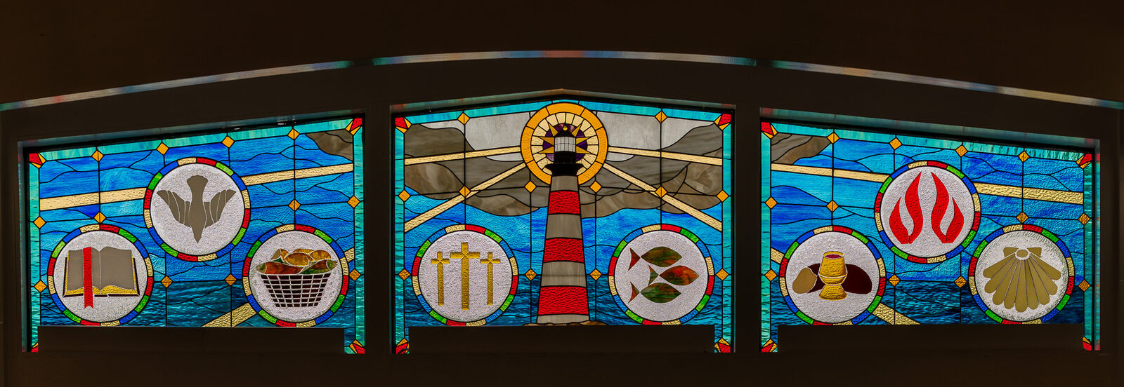 Stained-glass communion windows in the Harbor View Presbyterian Church sanctuary